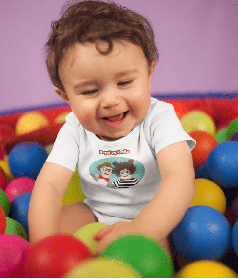 white-baby-boy-wearing-a-onesie-smiling-while-playing-in-the-ball-pit-mockup-14026